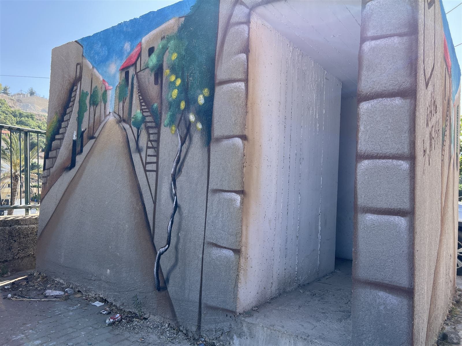 Shelter painted with a village landscape mural